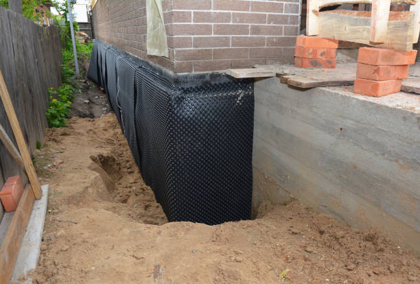 Happy homeowners after waterproofing job in Orchard Park